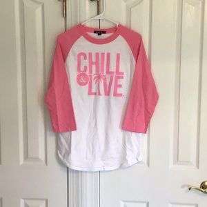 Sport Tek baseball-style shirt, 3/4 length sleeves. Bubble gum pink, white.